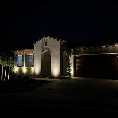 Professional curb appeal lighting adds beauty to this home in the Sierra Foothills. Photo